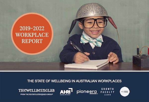 Wellbeing Lab report 2019-2022 front cover shows a child with black rimmed glasses writing in a book, and wearing a silver helmet.